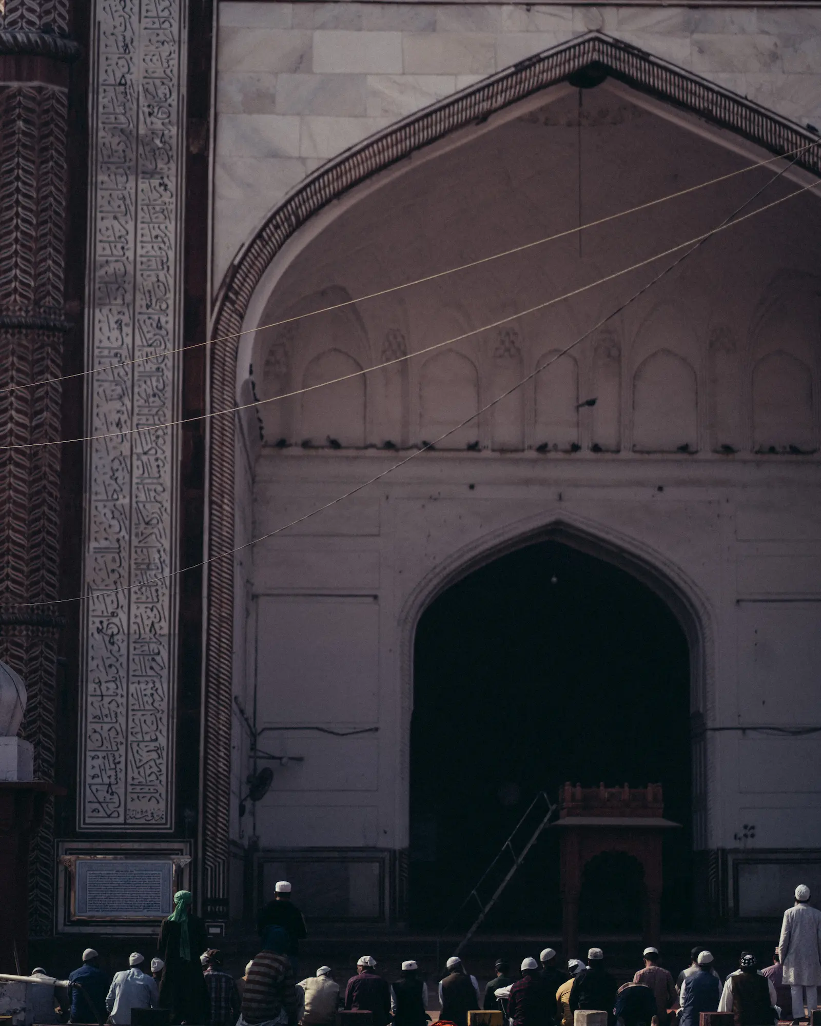 Men praying in Jama Masjid, Agra