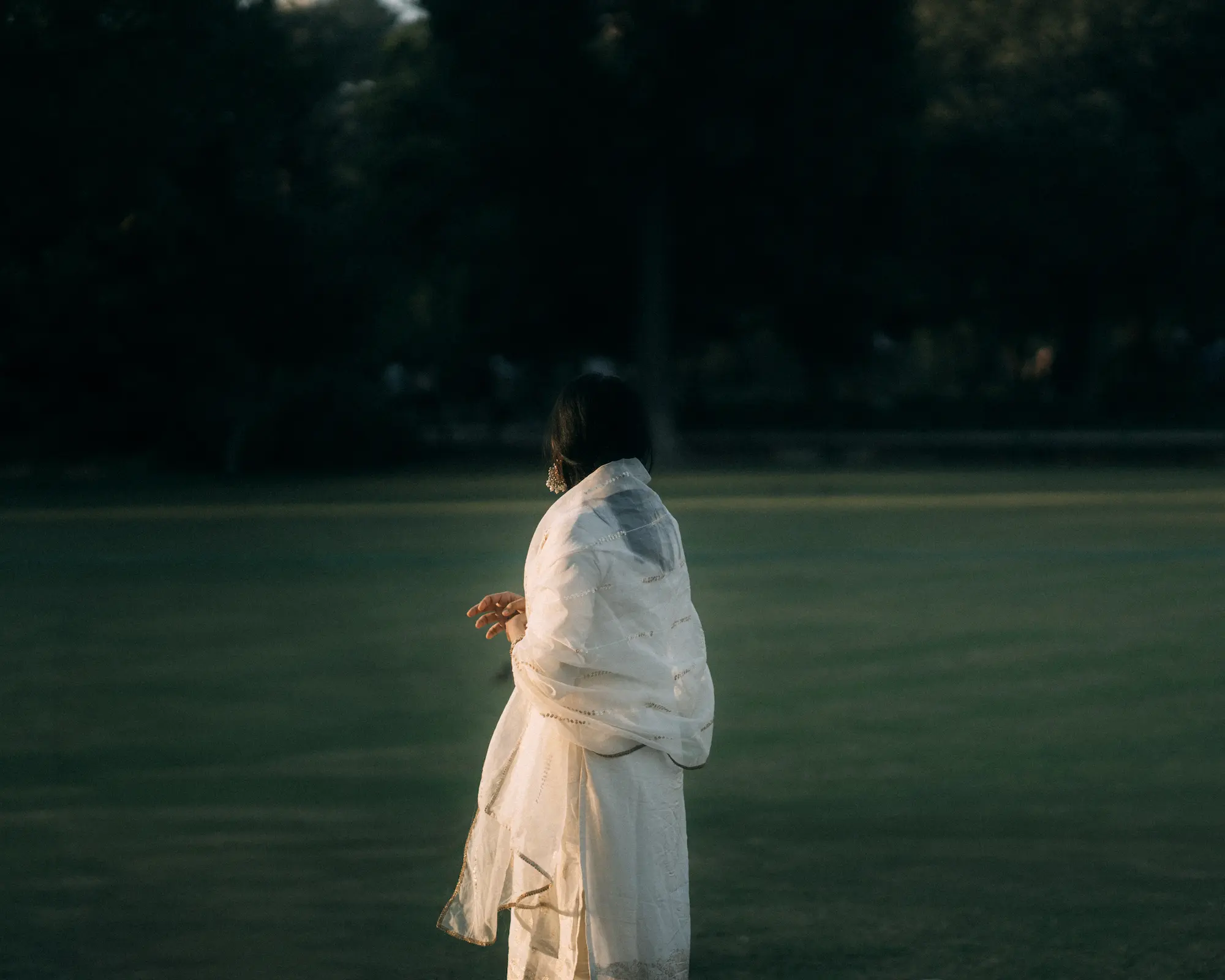 A woman in gardens of Taj Mahal