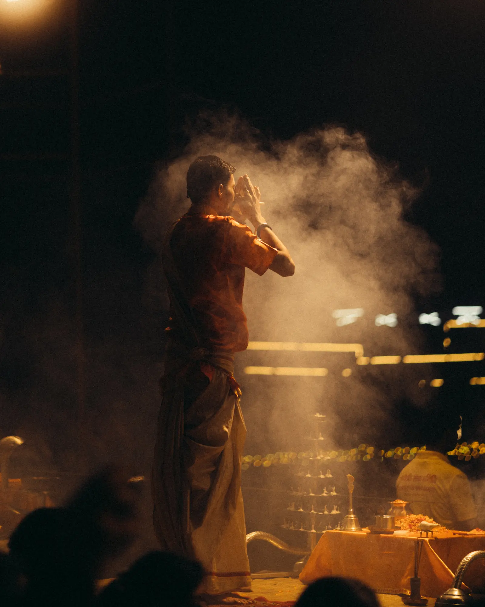 Priest blowing the conch/shankh during Ganga Aarti