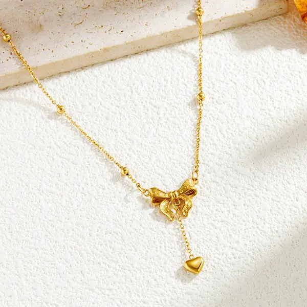 Bow tie and heart necklace 89