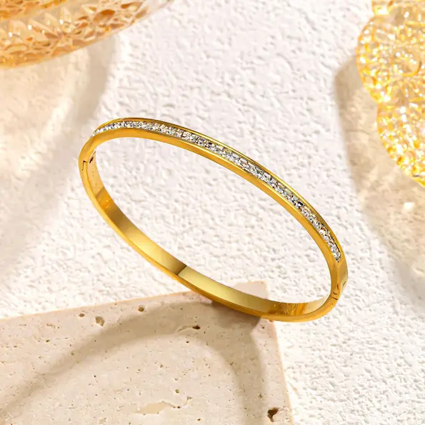 Single row of white diamonds in gold bangle 132