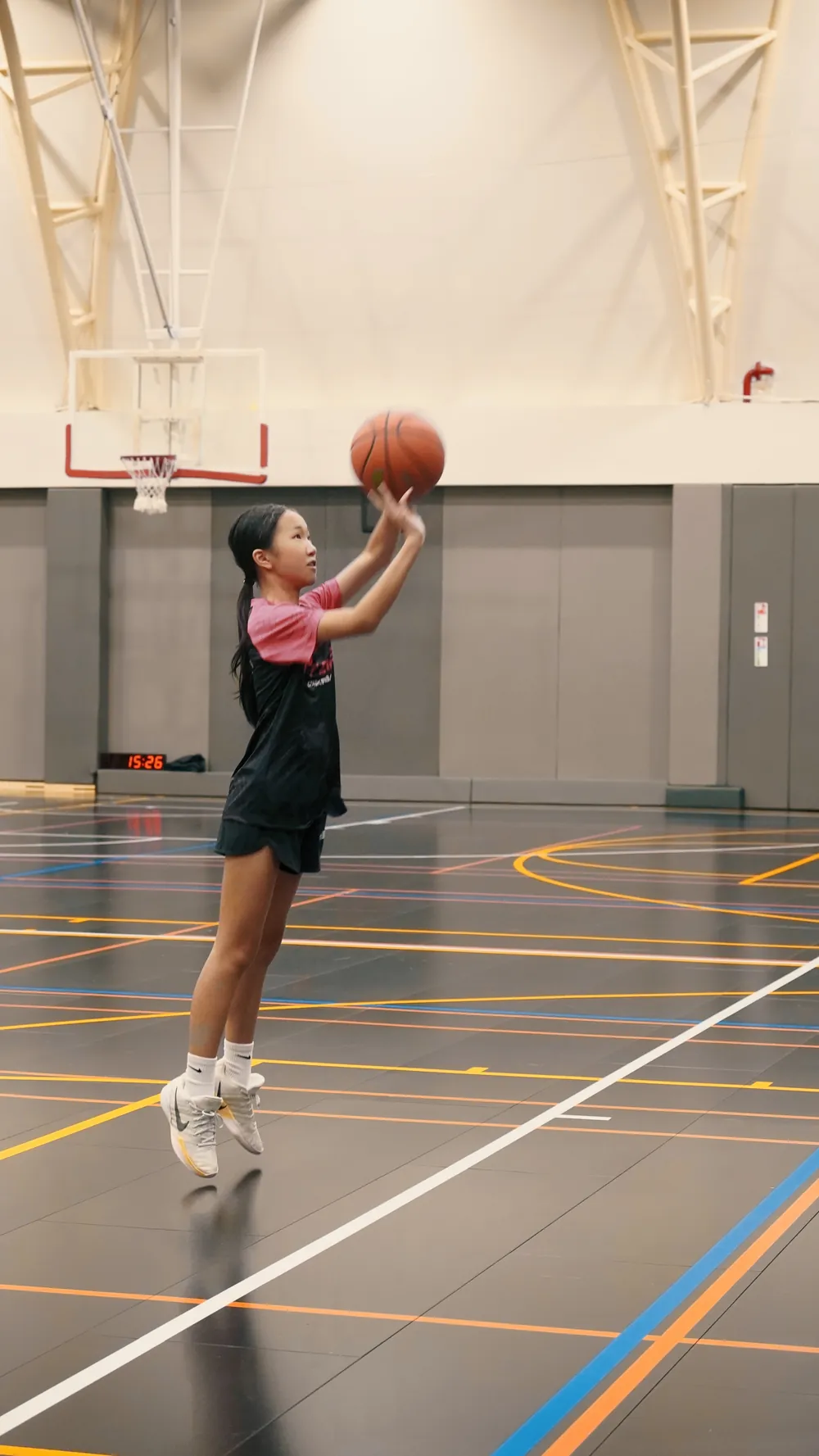U9 youth basketball player shooting during training at LIT Elite Academy HCMC