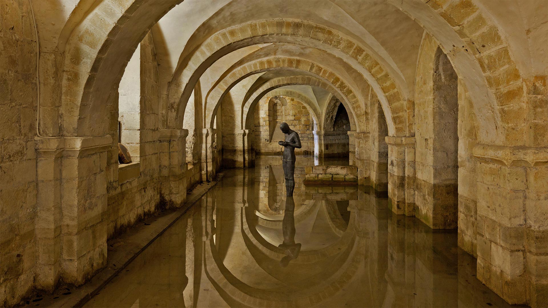 The flooded crypt at Winchester Cathedral, Hampshire, England - Oliver Hoffmann/Alamy)