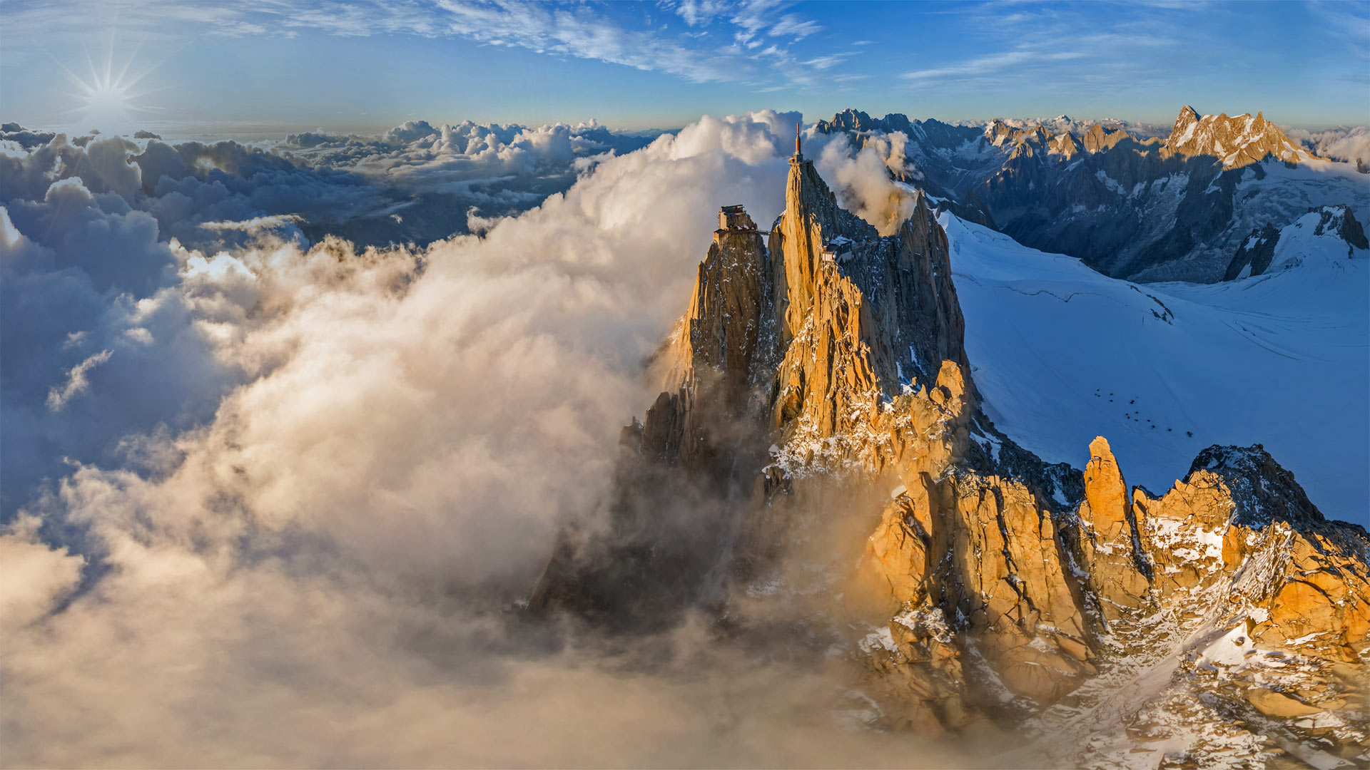 Aerial view of the Aiguille du Midi in the Mont Blanc massif, France - Amazing Aerial Agency/Offset by Shutterstock)