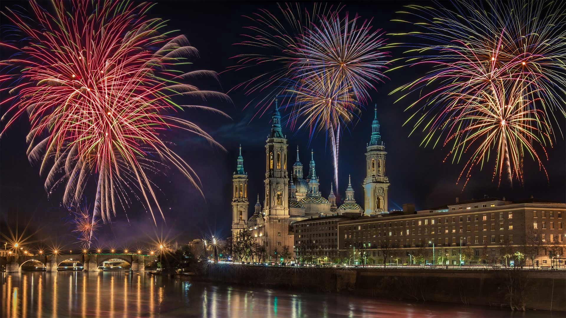 Fireworks during a New Year's Eve celebration in Zaragoza, Spain - Martina Badini/Shutterstock)
