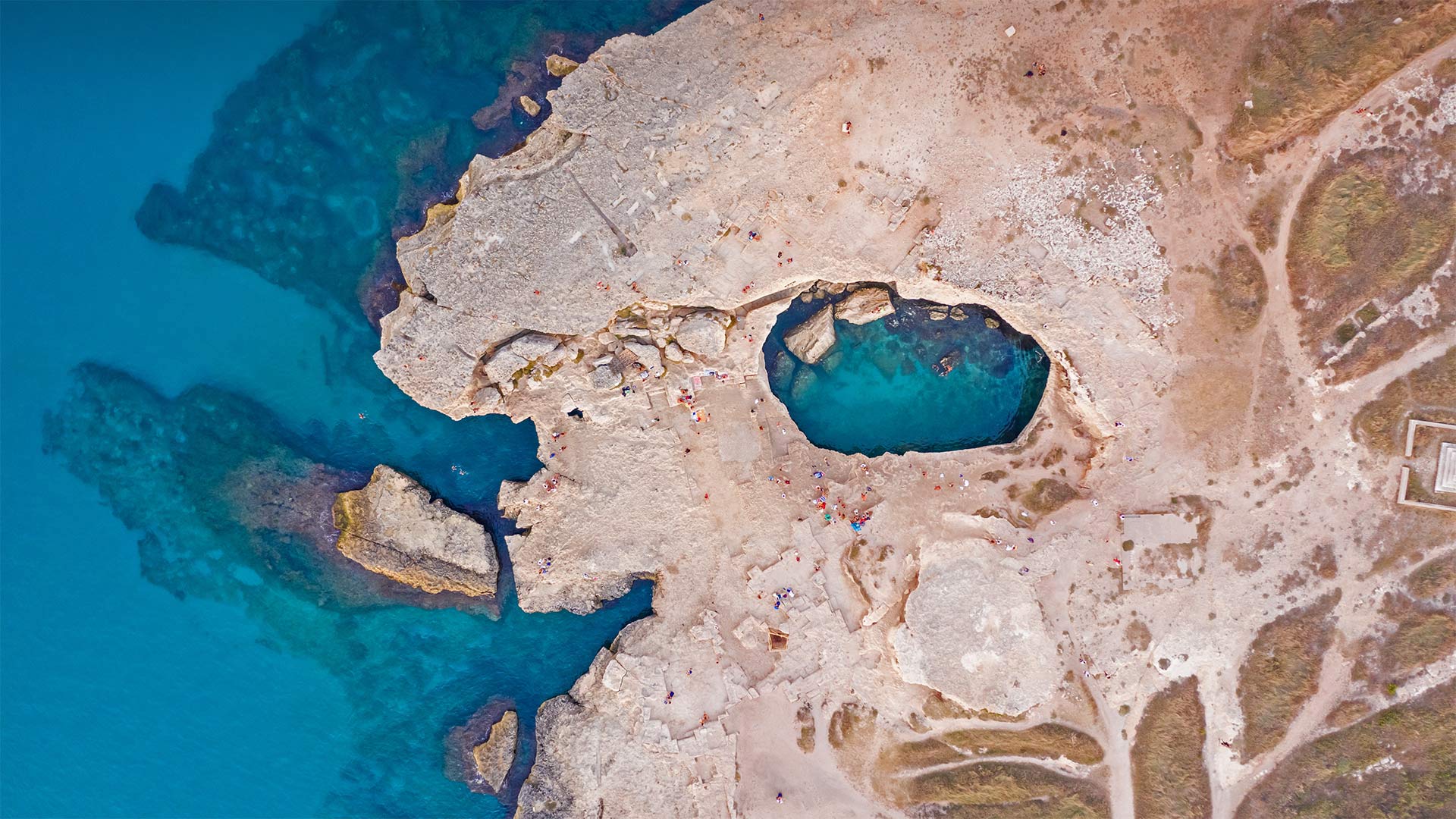 Aerial view of the Grotta della Poesia (Poetry's Cave) near Roca, Lecce, Italy - Amazing Aerial Agency/Offset by Shutterstock)