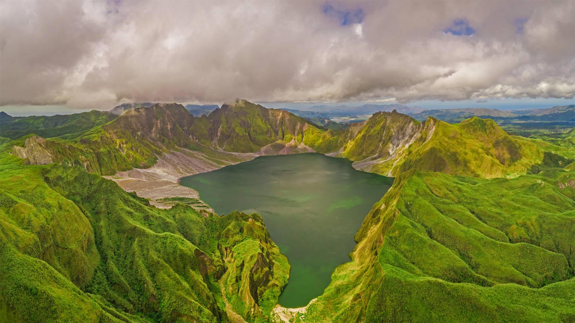 Aerial view of volcanic Lake Pinatubo and mountains, Luzon, Philippines - Amazing Aerial Agency/Offset by Shutterstock)