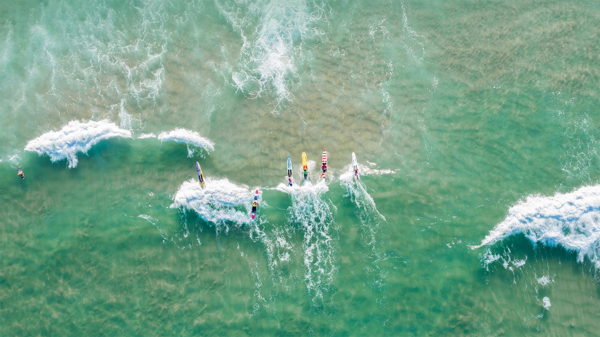 People surfing at Burleigh Heads, Gold Coast, Australia - Vicki Smith/Getty Images)