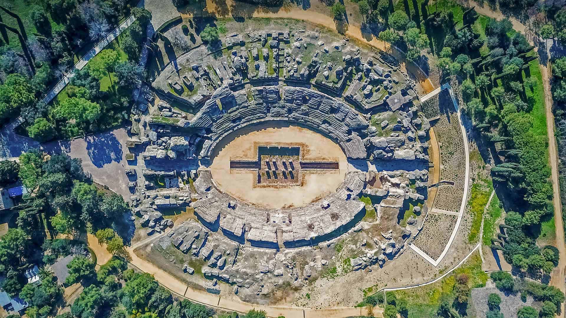 The Roman amphitheater of Itálica, near Seville, Spain - Amazing Aerial Agency/Offset by Shutterstock)