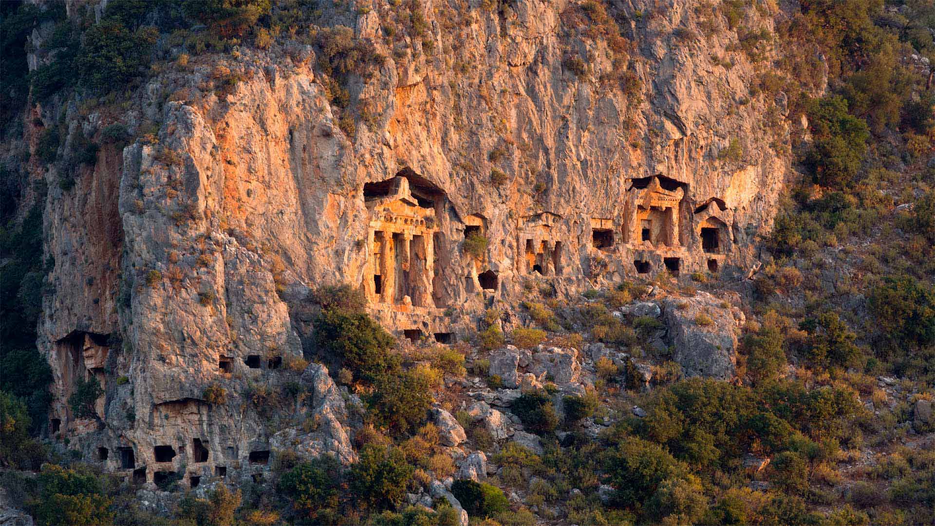 Ancient rock tombs carved into the cliff near Dalyan, Turkey - Reinhard Schmid/eStock Photo)