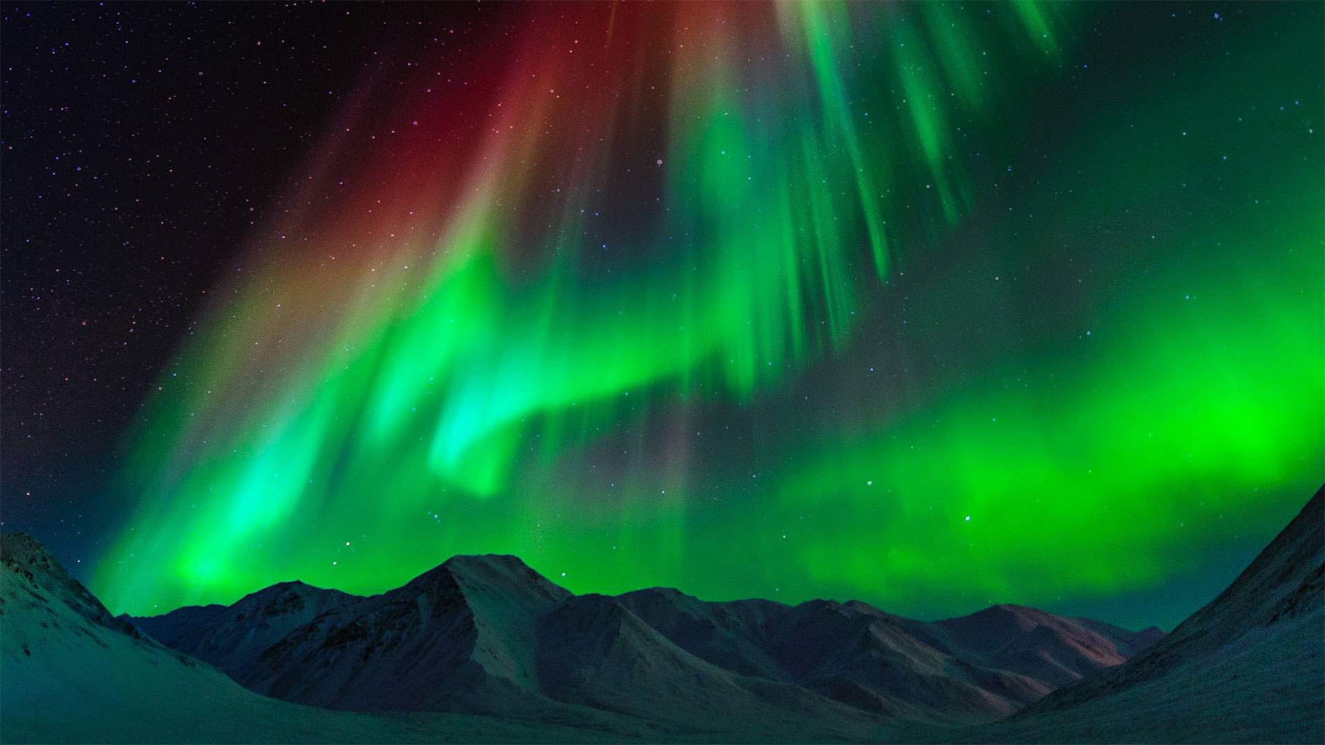 Aurora borealis above the Brooks Range in Alaska - Noppawat Tom Charoensinphon/Getty Images)