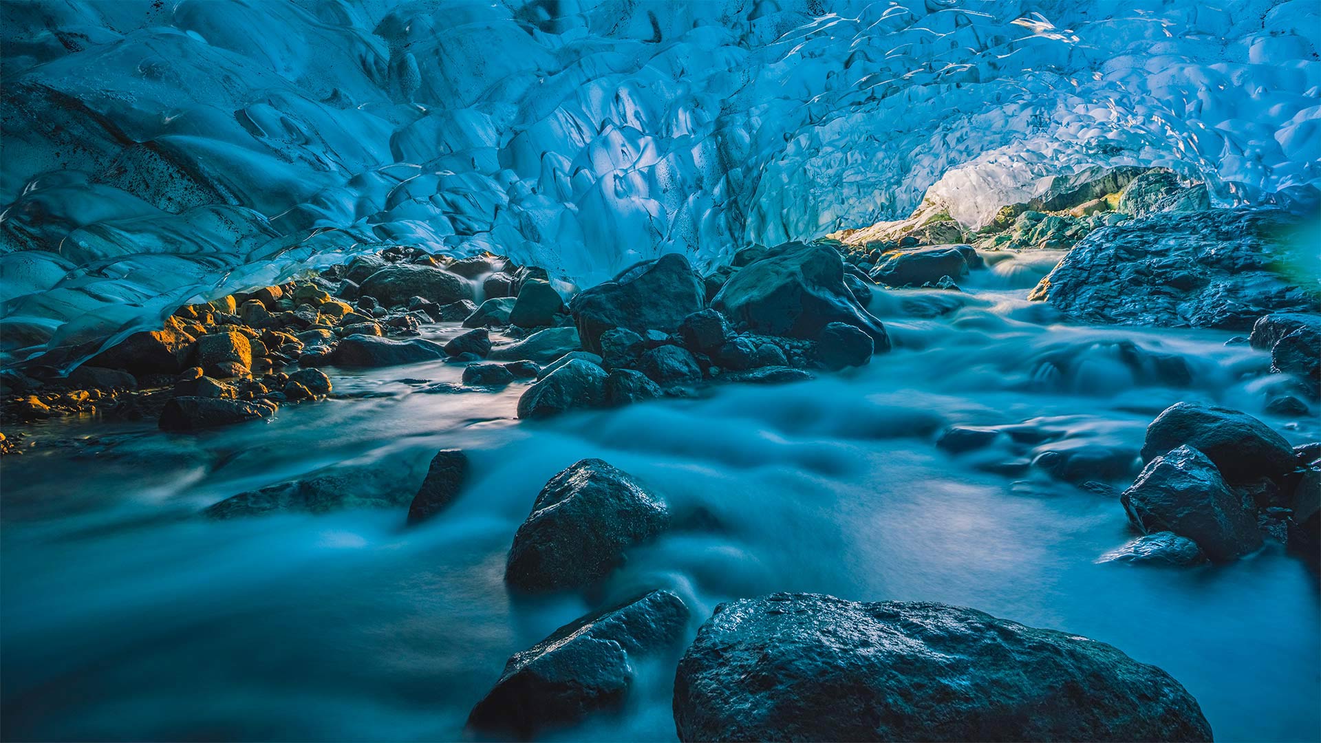 Flowing river inside a glacier cave, Vatnajökull, Iceland - Marco Bottigelli/Getty Images)