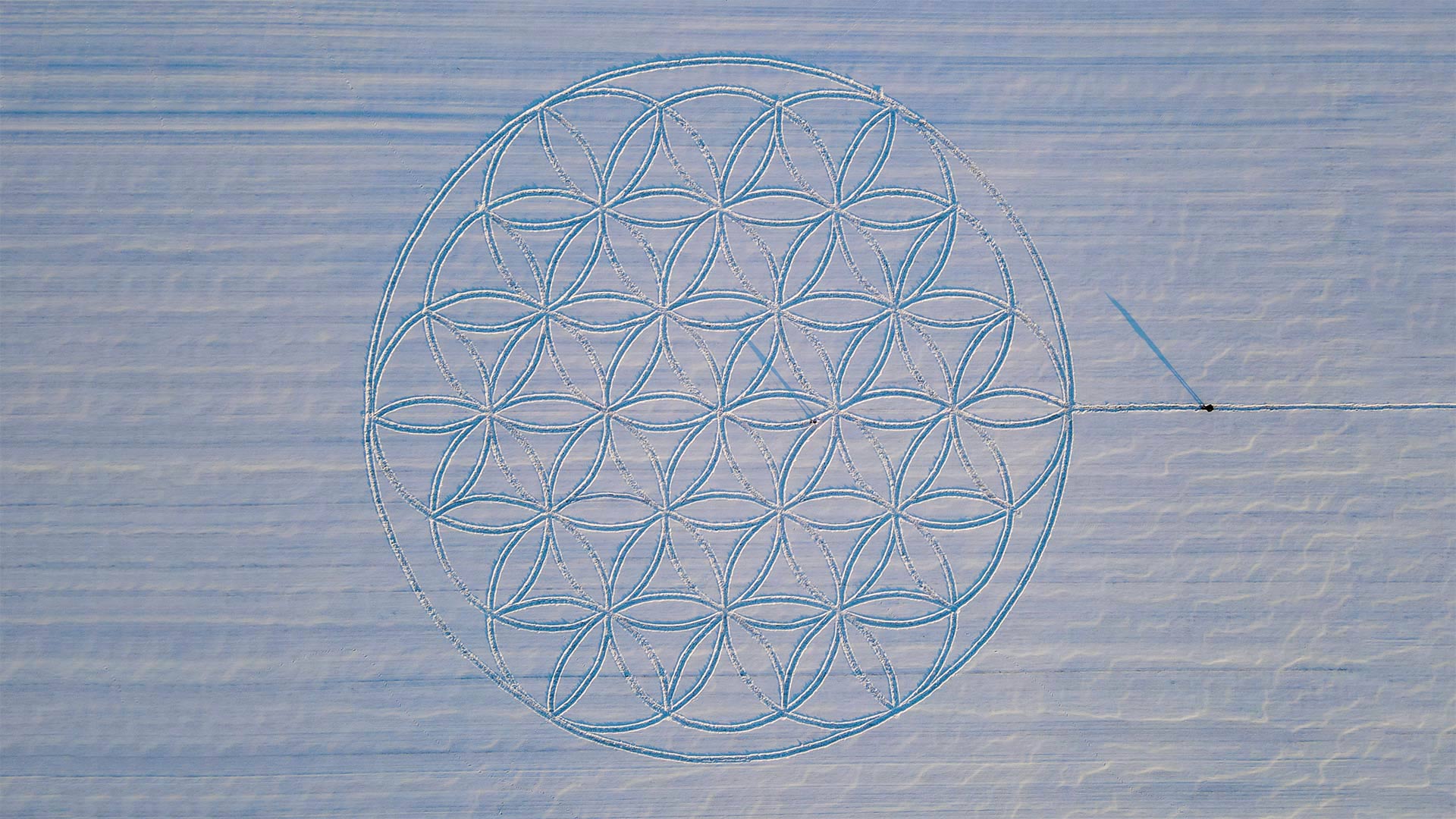 The 'Flower of Life' symbol drawn in the snow by artist Michael Uy, Jacobsdorf, Brandenburg, Germany - Patrick Pleul/picture alliance via Getty Images)