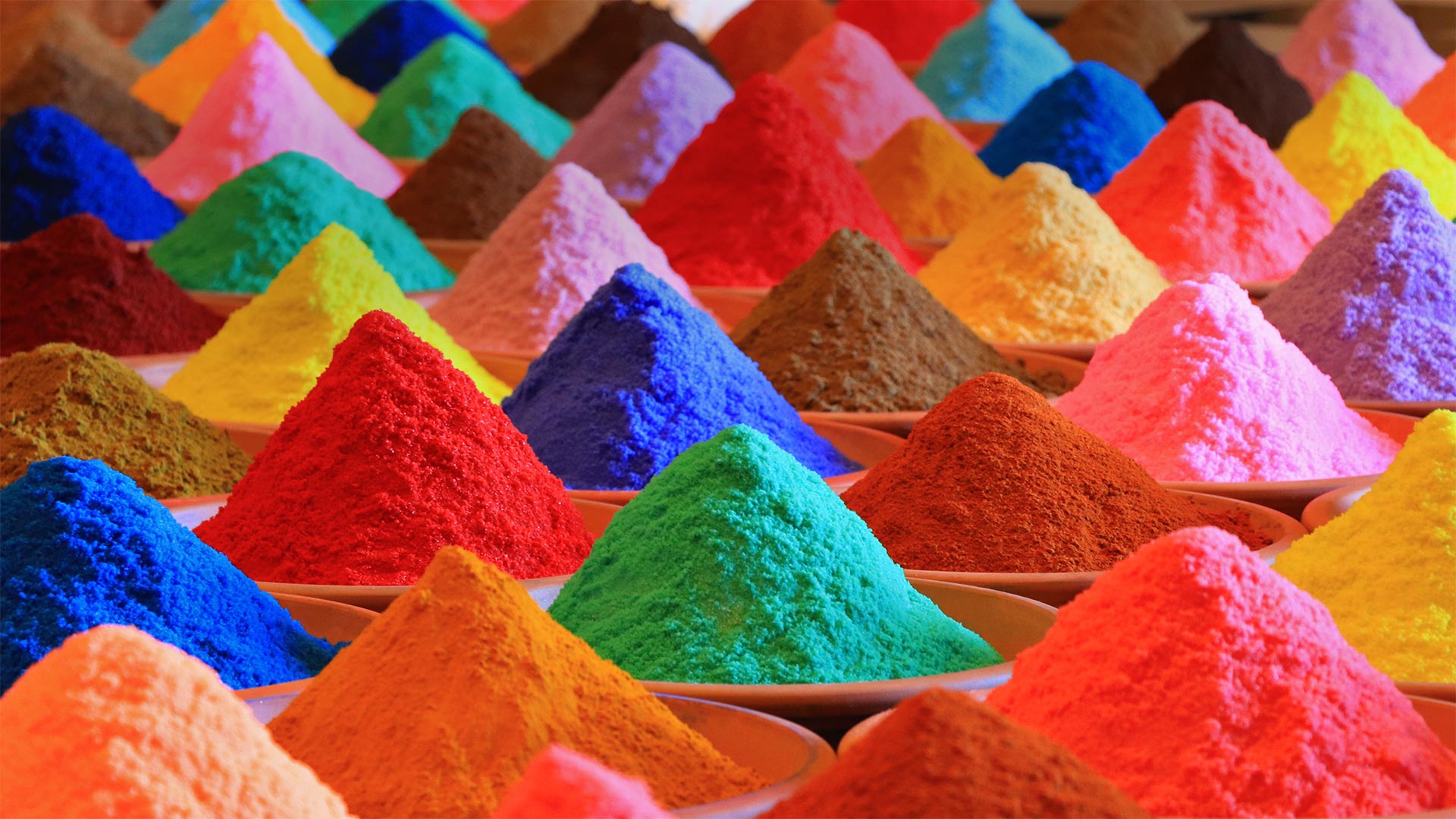 Multicolored powders for sale during Holi - Nuno Valadas/Getty Images)