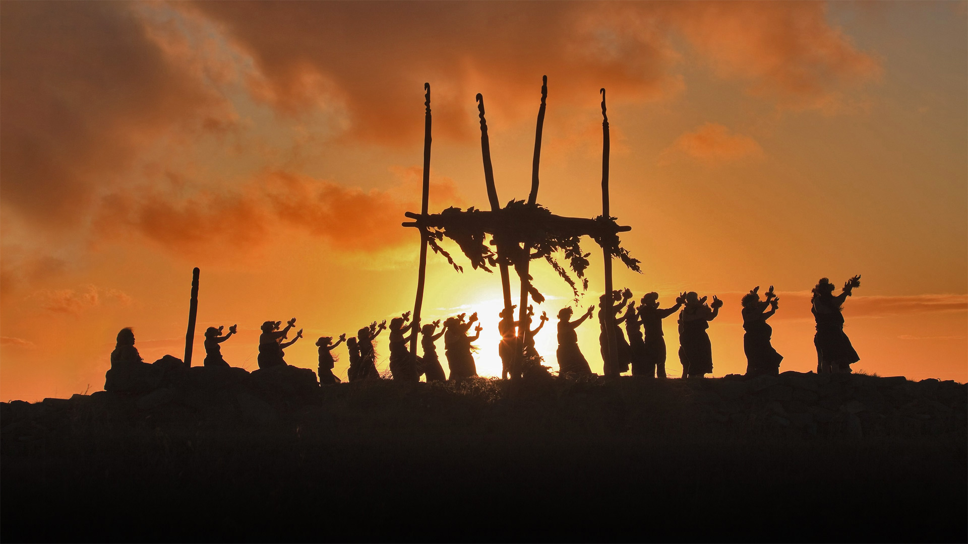 Dancers on the site of a lele (altar) on Mount Maunaloa, Molokai, Hawaii - Alvis Upitis/Getty Images)