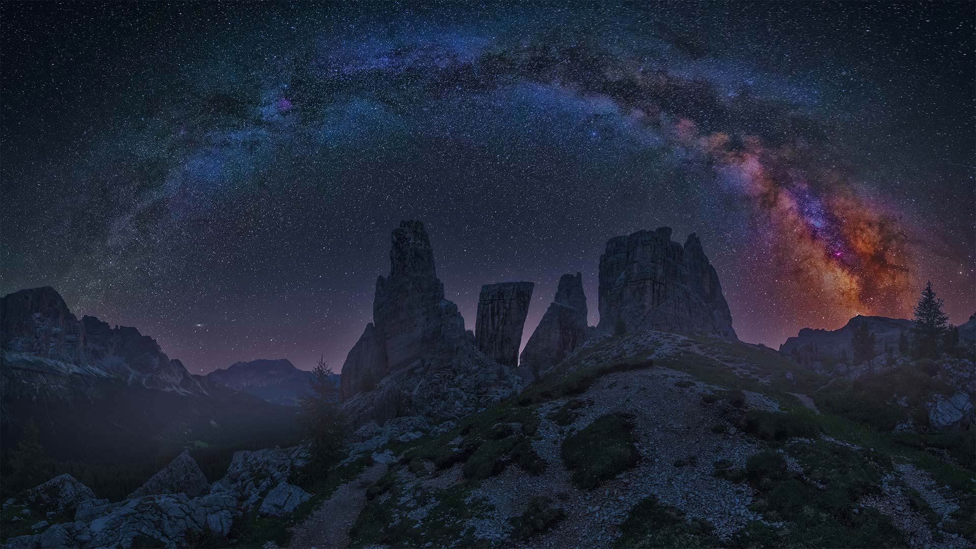 Dolomite Mountains at night with the Milky Way, Italy - Carlos Fernandez/Getty Images)