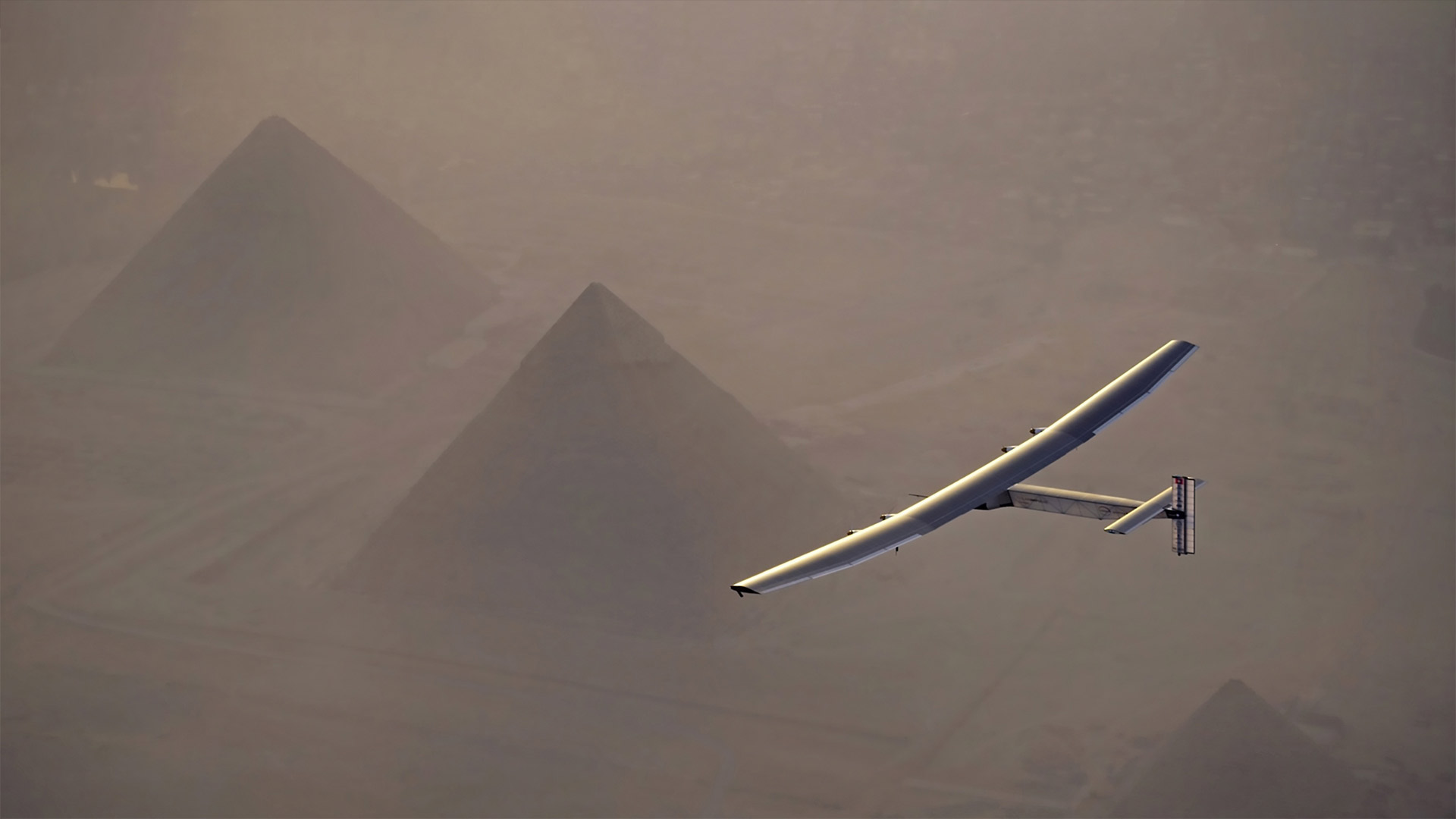Solar Impulse 2 flying over the pyramids in Giza, Egypt - Jean Revillard/Solar Impulse2 via Getty Images)