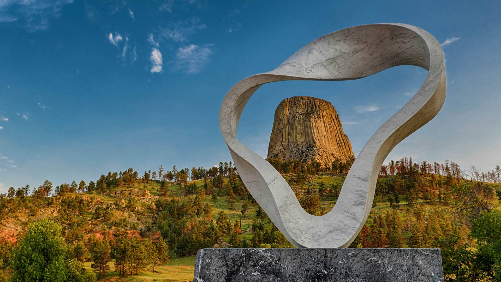 The 'Circle of Sacred Smoke' sculpture by Junkyu Muto frames Devils Tower in Wyoming - Nagel Photography/Shutterstock)