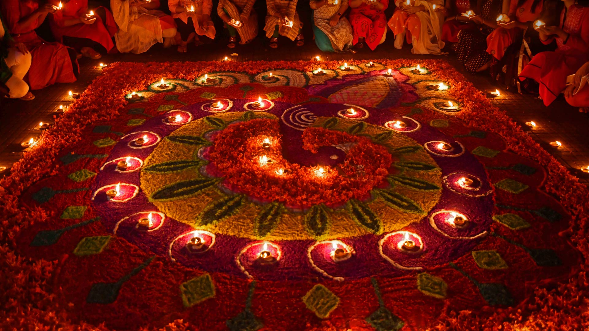 Oil lamps arranged on a rangoli to celebrate Diwali in Guwahati, India - Biju Boro/Getty Images)