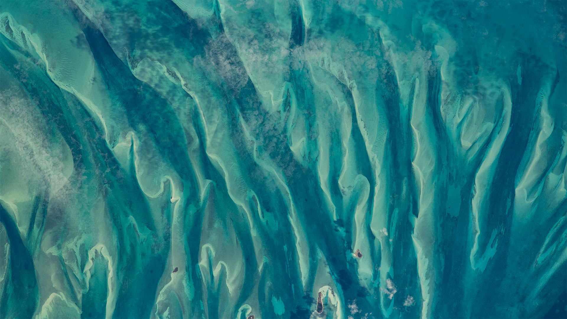Blue-green waters around the Bahamas as seen from the International Space Station - NASA)