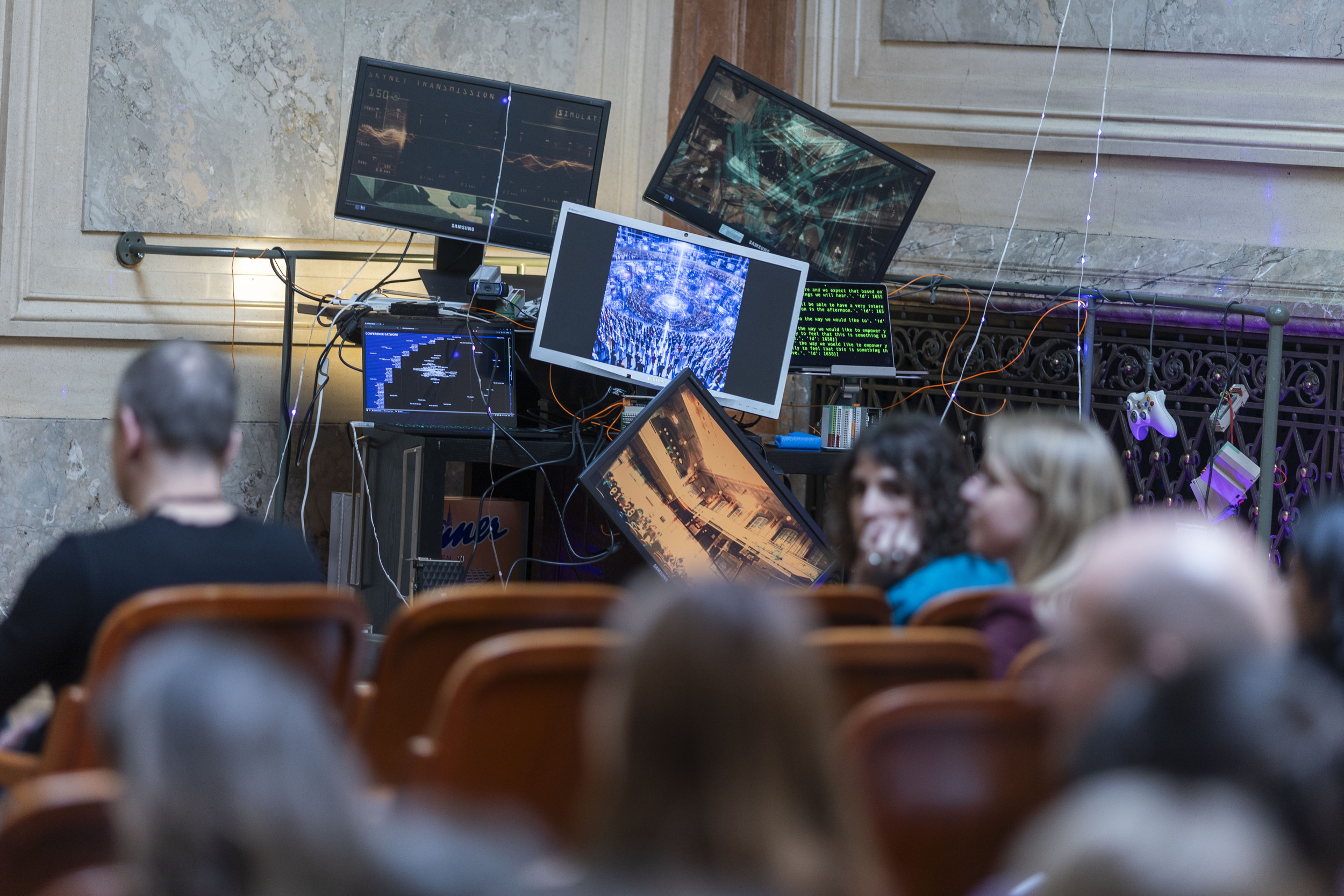 The Pile of Trash installation at the stage shot through the perspective of a conference participant