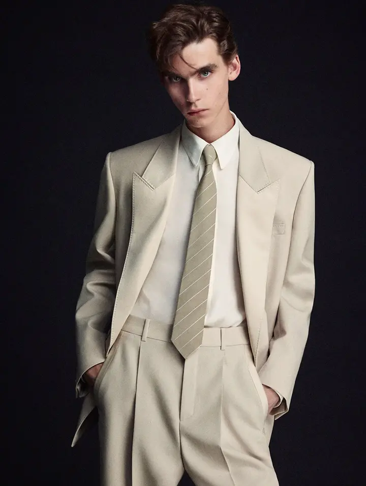 Man model wearing white smoking by Yves Saint Laurent