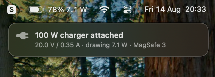 A notice under the menu bar reading 100 W charger attached, and beneath it 20.0 V / 0.35 A, drawing 7.1 W, MagSafe 3.
