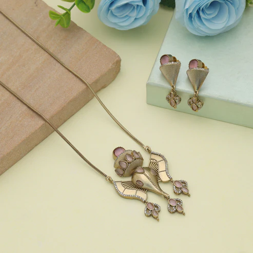 Stylish Light Pink Color Lord Ganesha American Diamond Necklace Set For Women - Vogdiary