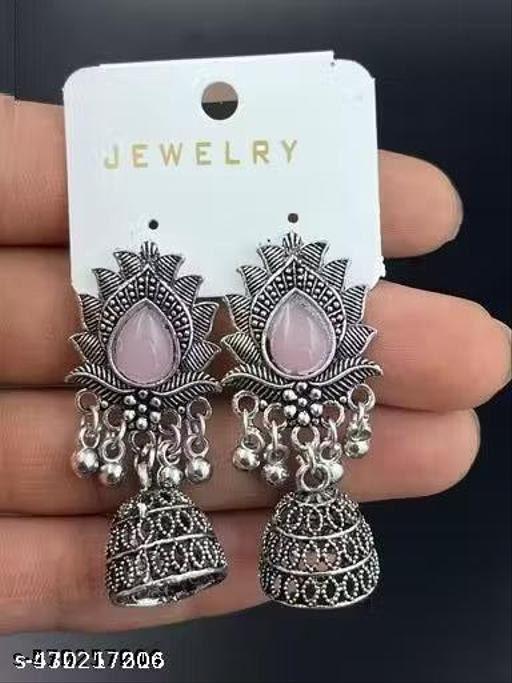 These stunning oxidized silver jhumkas feature vibrant red, green, and pink hues, perfect for festive occasions. Their intricate designs complement any outfit, adding a touch of elegance and tradition, making them an ideal accessory for celebrating in style - Akhilo.com