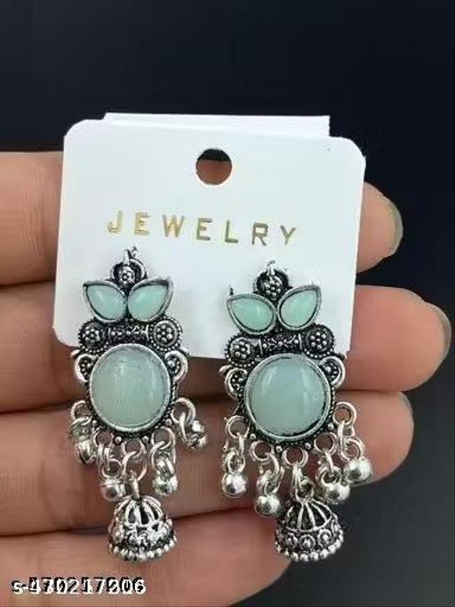 These stunning oxidized silver jhumkas feature vibrant red, green, and pink hues, perfect for festive occasions. Their intricate designs complement any outfit, adding a touch of elegance and tradition, making them an ideal accessory for celebrating in style - Akhilo.com