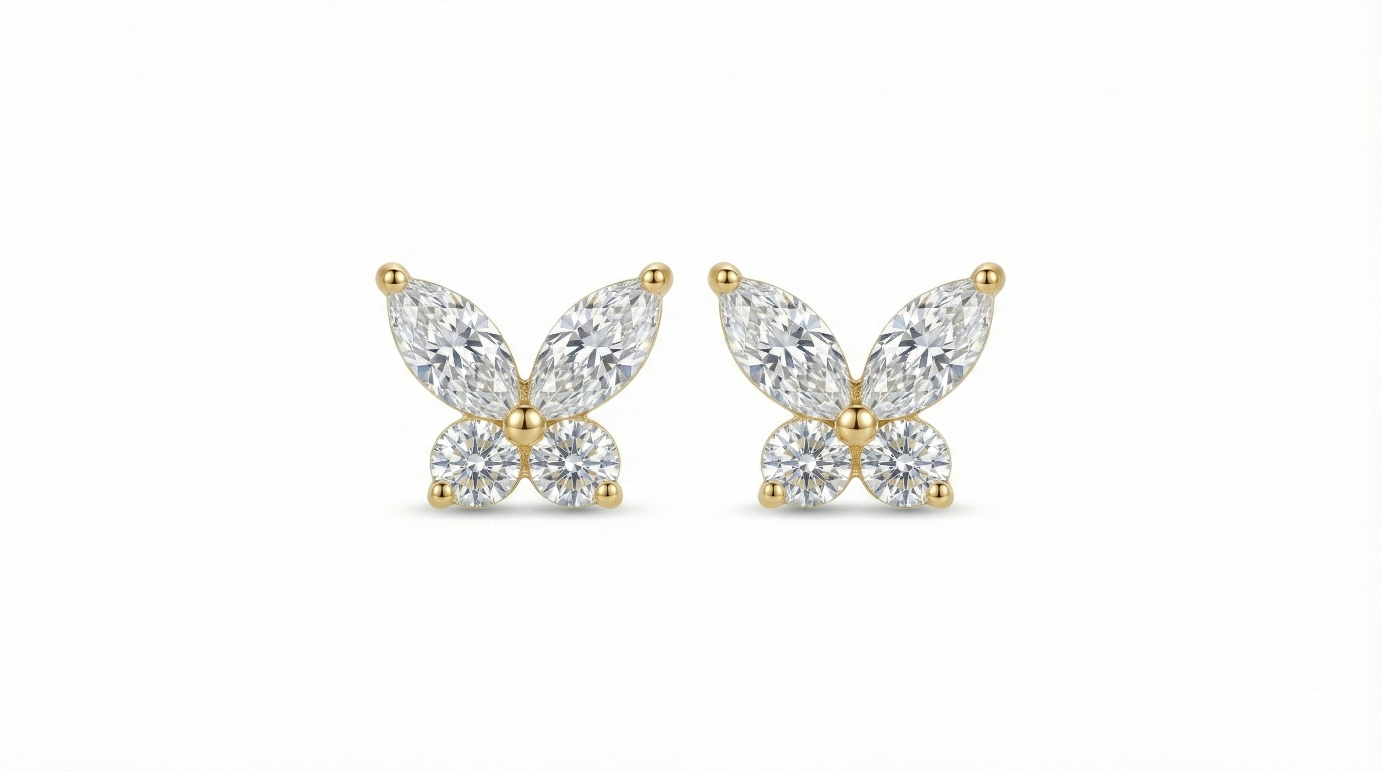 Náušnice zlatavého tónu v podobě motýla