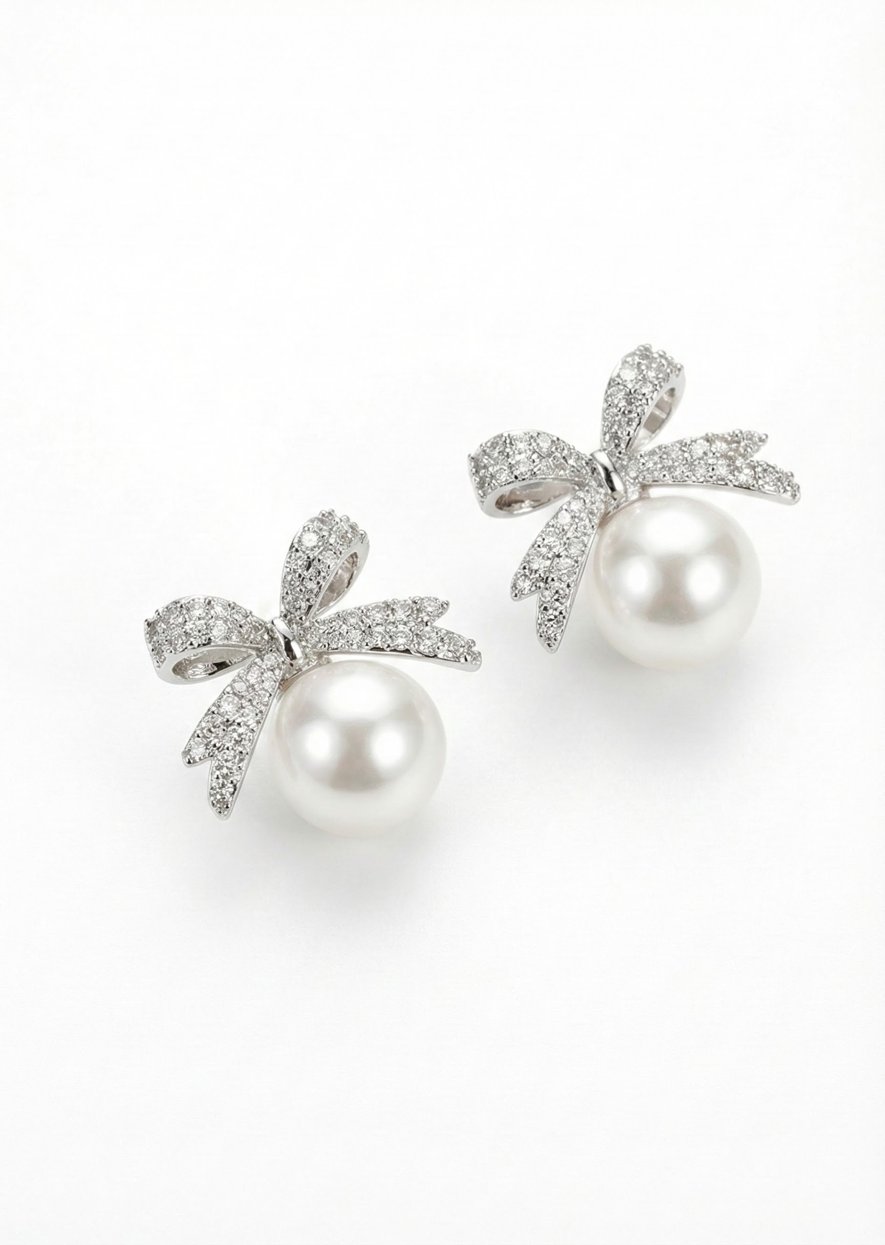 Náušnice v podobě mašle s perlou