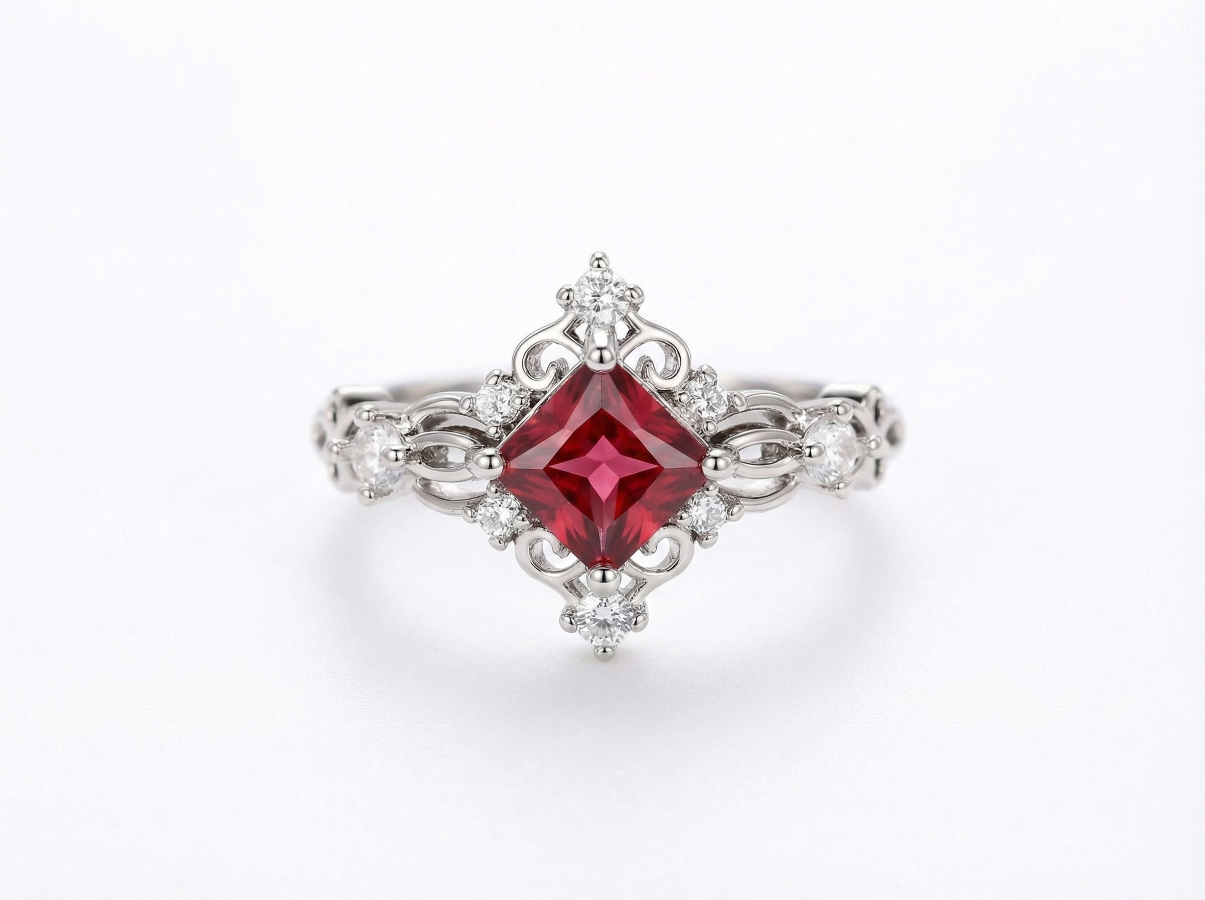 Prsten v barvě rubínu a osazeními krystaly