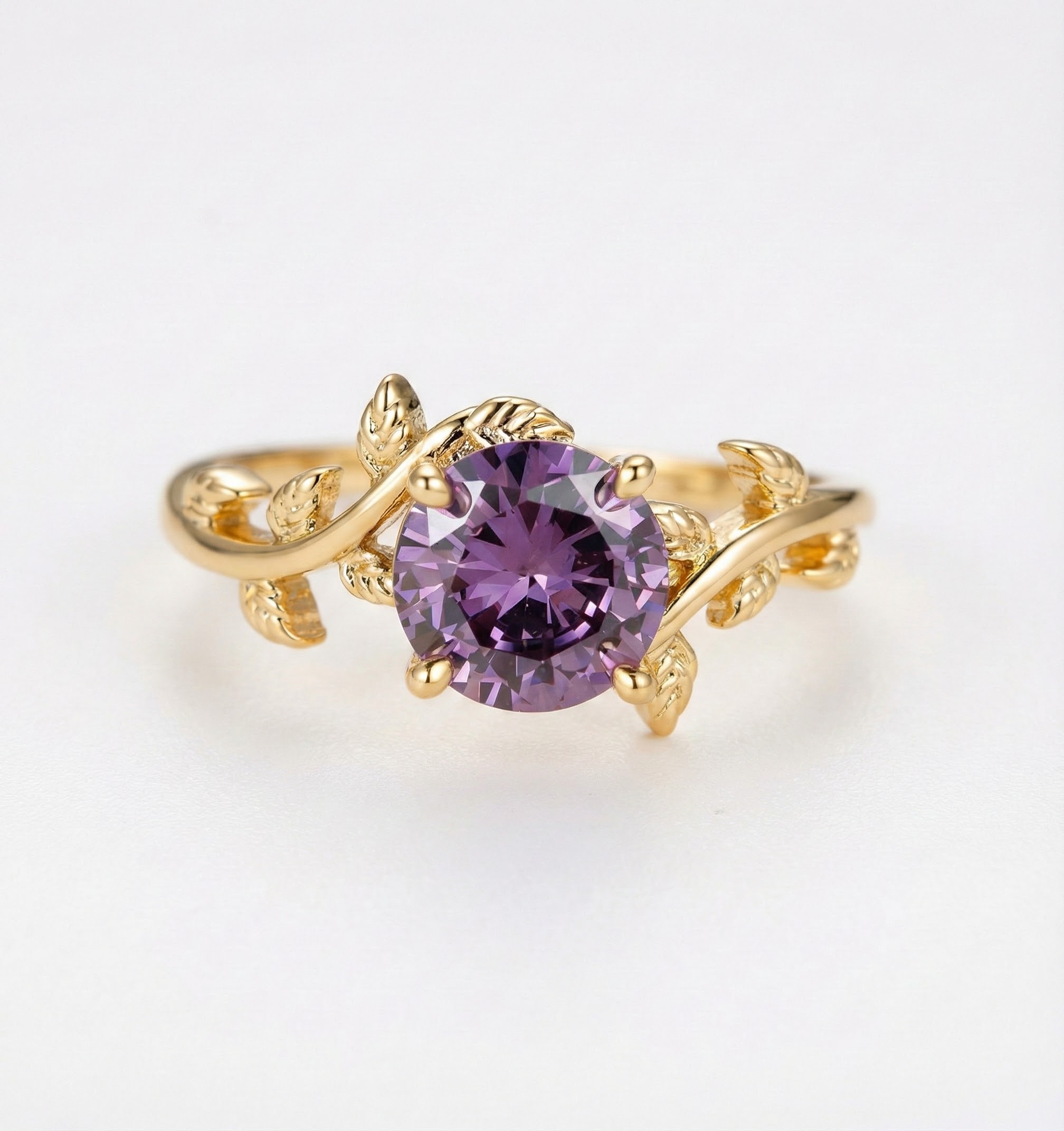 Prsten s motivem lístků ve zlatavém tónu s broušenými krystaly v barvě ametystu