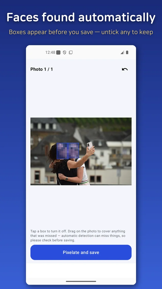 Two faces in a selfie detected automatically and marked for the photo mosaic before saving