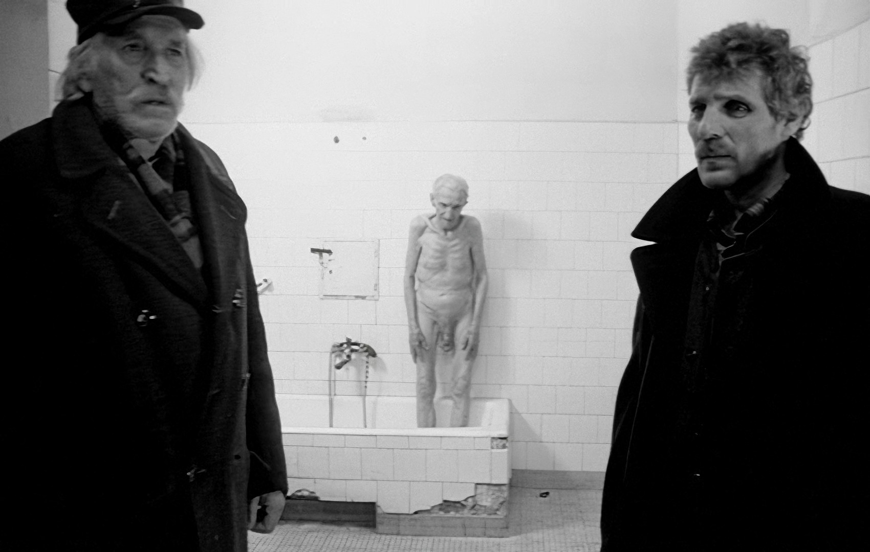 When the angry crowd sees the wreckage of the old man's body in the hospital, the violence stops