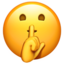 face with finger covering closed lips