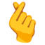 Hand with index finger and thumb crossed Google Noto emoji